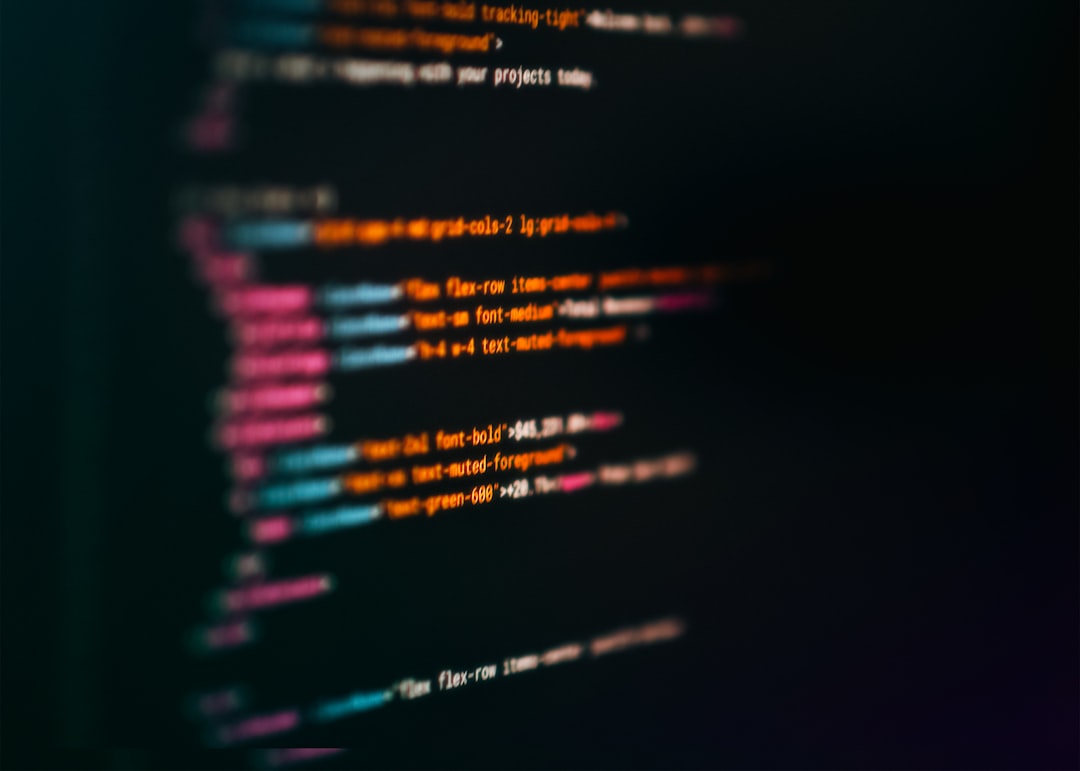 Colorful HTML Code Snippet Programming Interface. Close-up blurred screen with colorful syntax highlighting of programming markup language